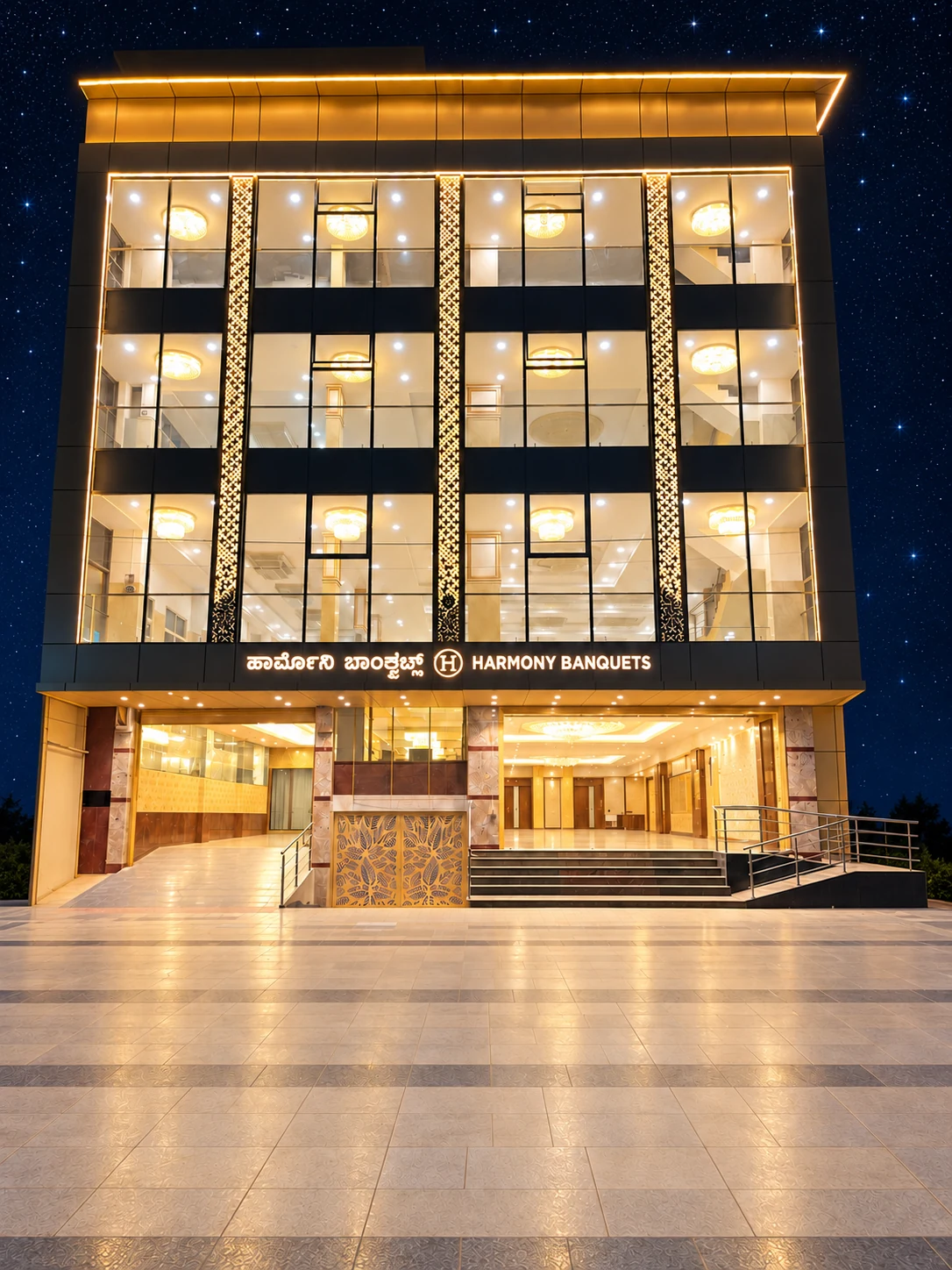 Harmony Banquets illuminated building beneath a starry sky, including the full façade, signage and entrance.